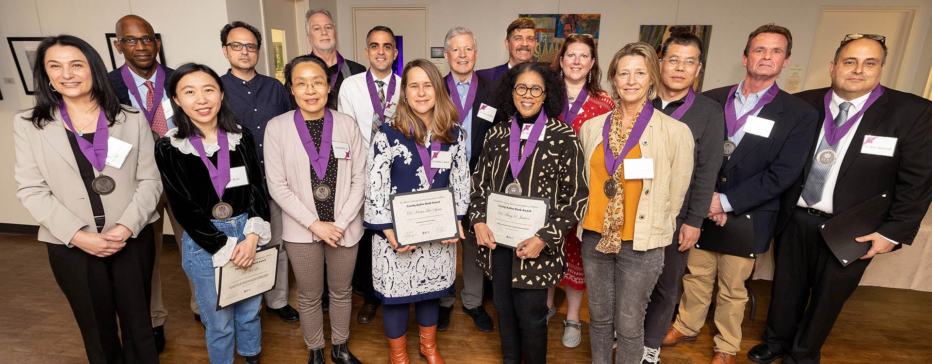 Faculty authors gather after the ECU Main Campus Faculty Author Book and Affordable Textbooks Awards at the Janice Hardison Faulkner Gallery. 
