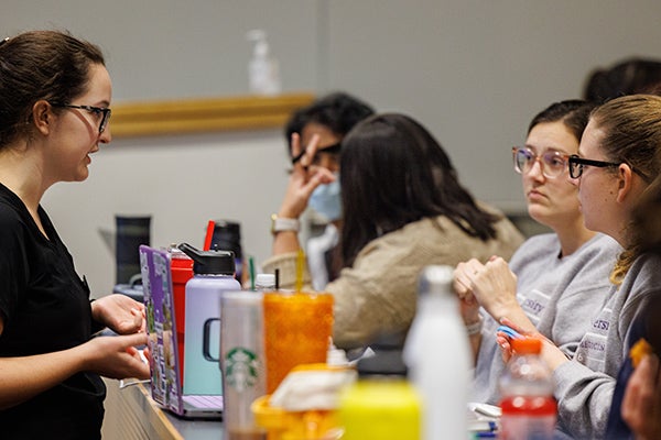 East Carolina University occupational therapy students give dental students tips on exercises to strengthen their hands for the long hours they work with drills, probes and mirrors.