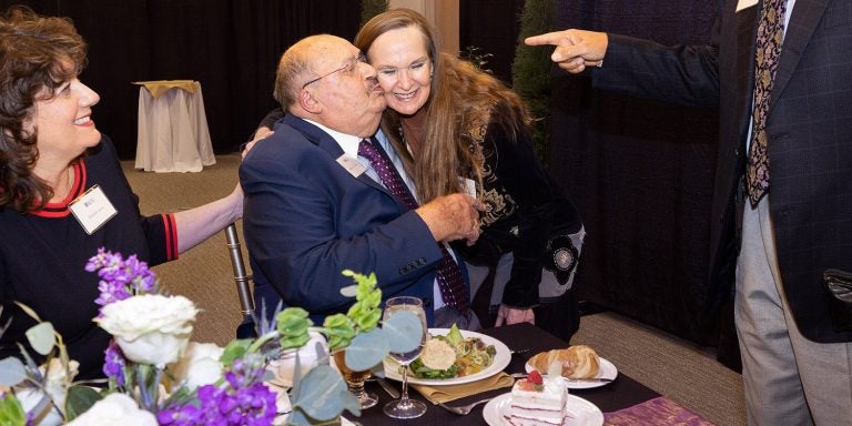James G. “Jim” Jones and his wife, Michelle, receive love and greetings from attendees at a luncheon honoring Jones. (ECU photo by Rhett Butler)