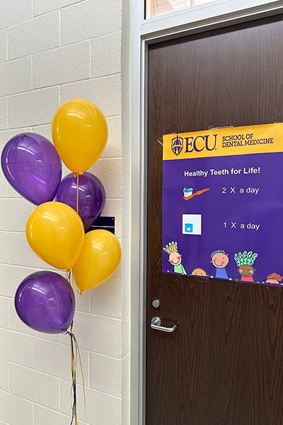 A sign in Trenton Elementary School in Jones County touts the new school-based oral health care program that the ECU School of Dental Medicine kicked off in early February. 