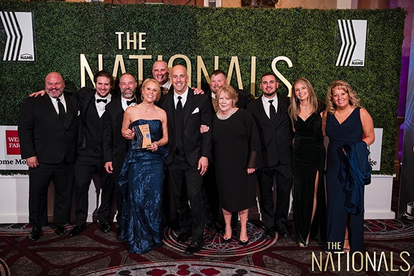 Members of the Marnie Custom Homes team celebrate Marnie Oursler being named the Custom Home Builder of the Year. From left, Jim Thompson, Gray Venables, Tim Supplee, Marnie Oursler ’01, Jeff Staniszewski, Jon Subity, Chuck Say, Karen Dunn, Dustin Burkett, Celeste Henry ’01, and Tammy Thomas, Not Pictured: Carrie Subity and Matt Millman.