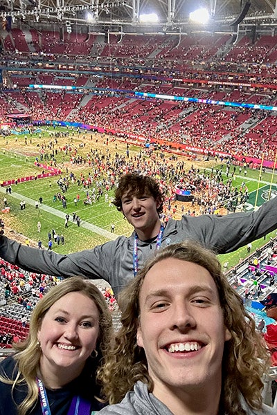 ECU's Tyler Burnham, front, takes a selfie with Mack Craven and Sam Cooper, back, as the Kansas City Chiefs celebrate winning Super Bowl LVII at State Farm Stadium.