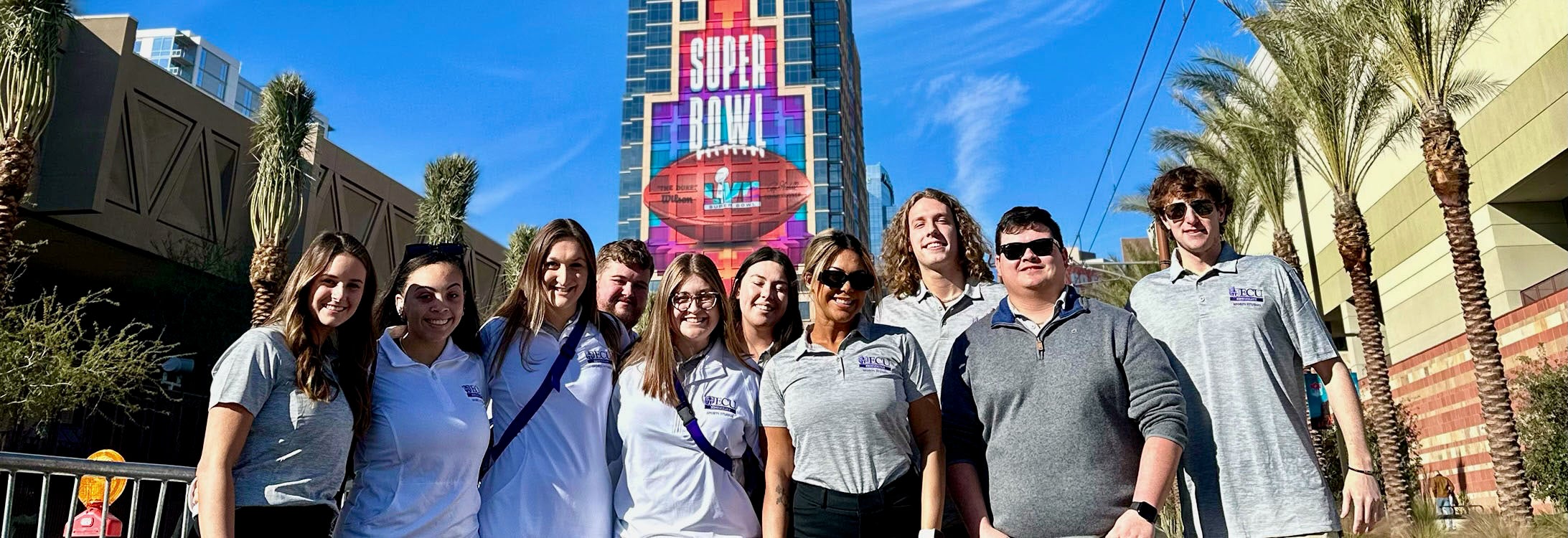 Students in East Carolina University's Super Bowl LVII Event Management class pose together during their experience volunteering at the Super Bowl in Glendale, Arizona.