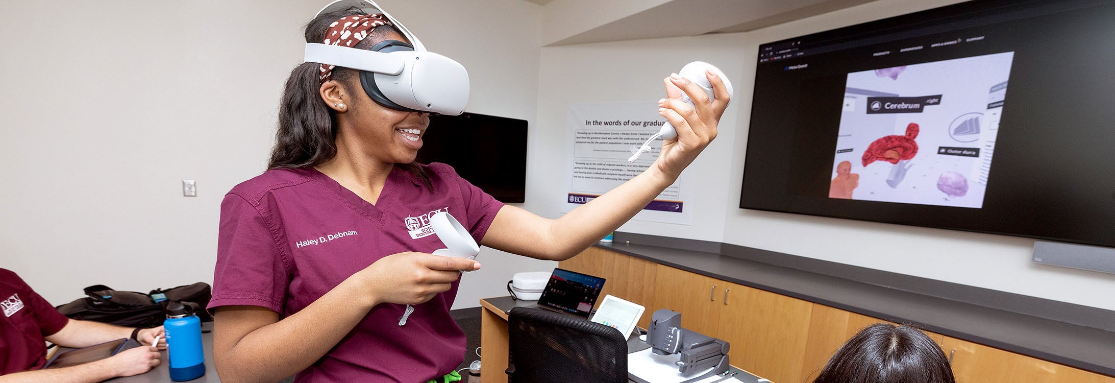East Carolina University School of Dental Medicine first-year dental student Haley Debnam tries out virtual reality equipment during class as she and her classmates learn the anatomy of the brain, head and neck.