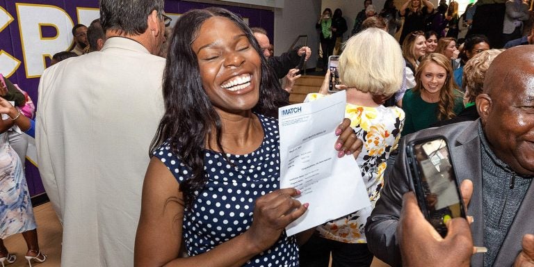 East Carolina University Brody School of Medicine student Merdi Lutete, left, celebrates with her father, Masiala Ngoma, during Match Day 2023. Fourth year medical students from across the country learned where they will spend the next part of their careers in residency.