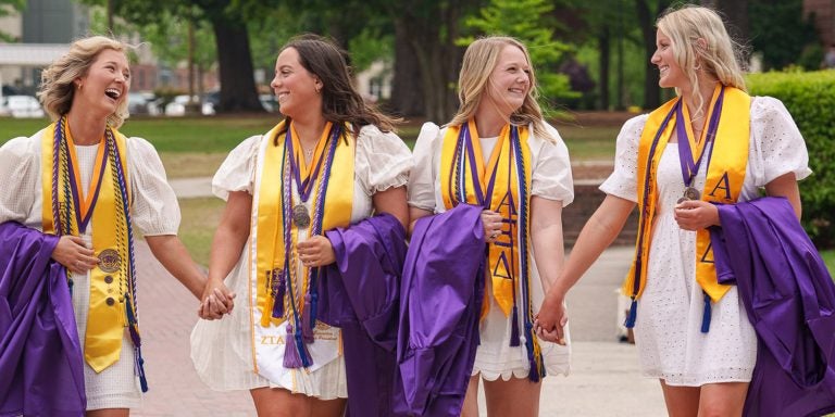 Wrenn Whitfield, from left, Teresa Hupp, Abby Ulffers and Kaylee Warren became best friends during their time at East Carolina University and encouraged each other on their journeys to success.