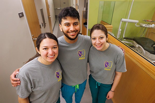 Hispanic Student Dental Association executive board members Ana Garcia, Alex Betancourt and Stephanie Camacho volunteered during the third annual Sonríe Clinic last month.