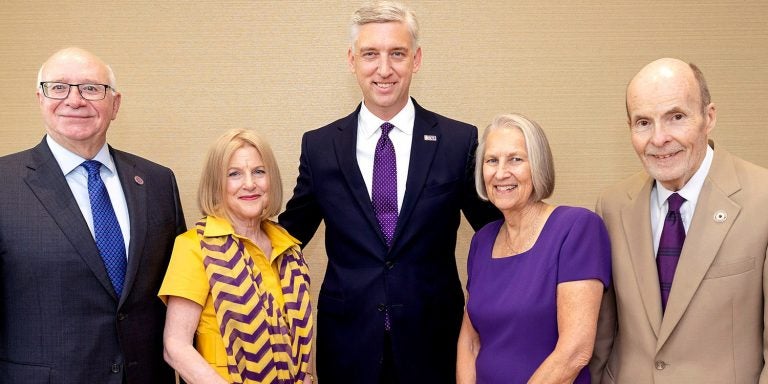 Robert and Amy Brinkley, left, and Pat and Lynn Lane, right, were honored by Chancellor Philip Rogers for their historic commitment to ECU.