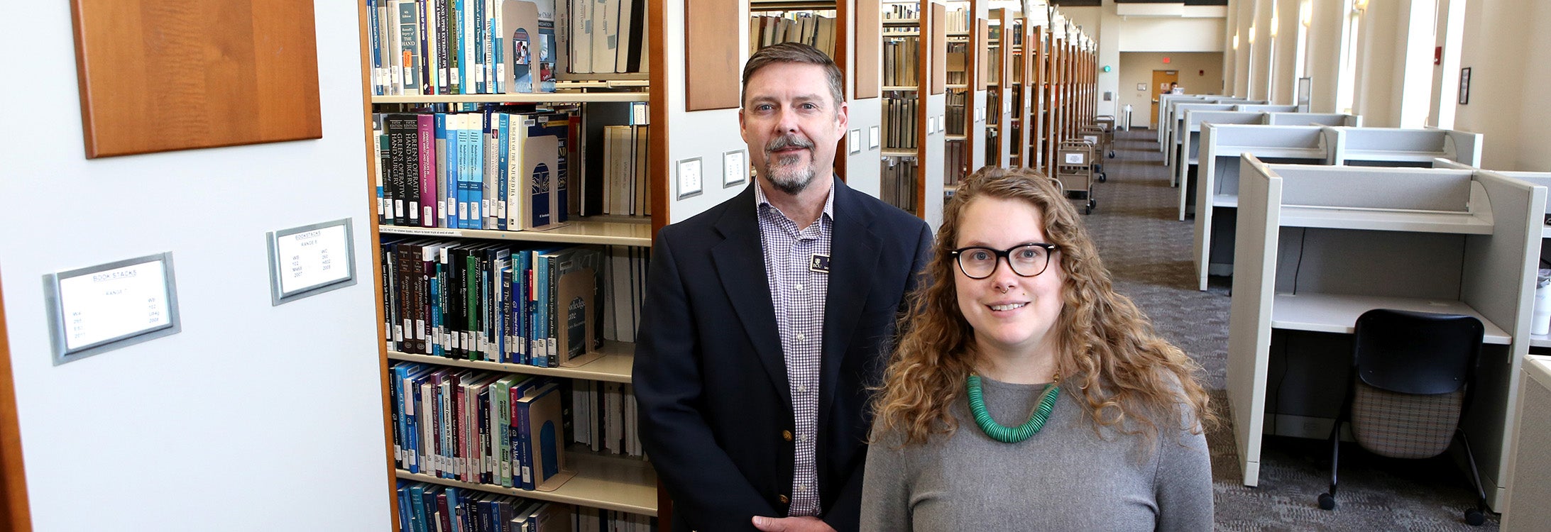 Roger Russell, associate director of Laupus Library, and Jamie Bloss, library associate professor and Laupus liaison librarian, partnered to lead a grant to improve digital literacy and broadband access for migrant farmworkers. (ECU photos by Benjamin Abel)