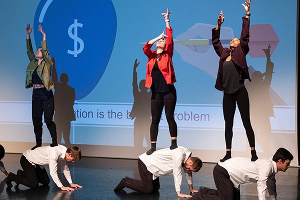 Dance and economics students act out economic principals.