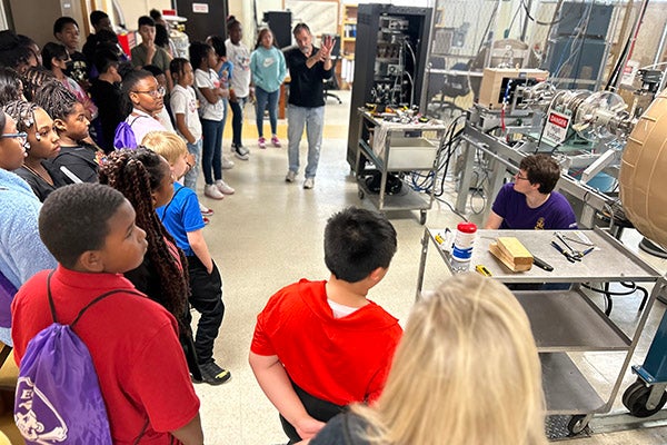 Students visit the physics particle accelerator in the Howell Science Complex.