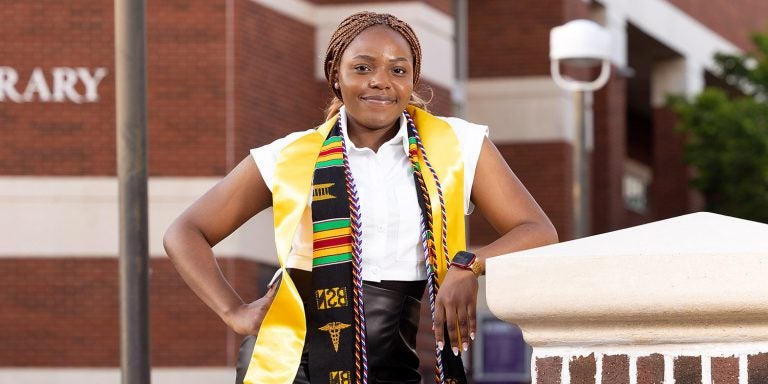 Esther Olajide graduated from East Carolina University's College of Nursing’s Bachelor of Nursing program after spending nearly a year deployed with the Navy.
