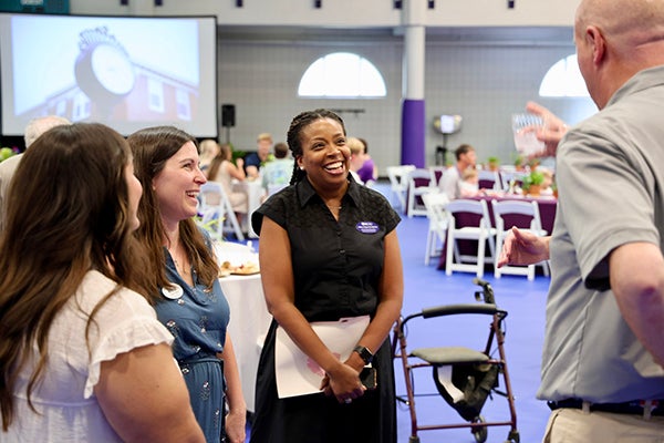 LaNika Wright, associate vice chancellor of health and well-being, visits with guests before speaking at the Chancellor’s Society event at the Eakin Student Recreation Center.