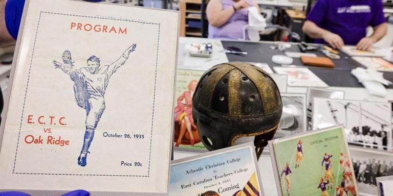 A game program from Oct. 26, 1935, is displayed along with other artifacts for the “No Quarter: The History of East Carolina Football and Dowdy-Ficklen Stadium” exhibition.