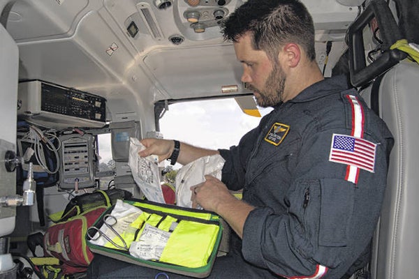 East Carolina University College of Nursing alum Jonathan Polak inventories supplies in his air ambulance. 