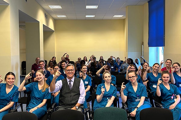 Mark Hand, an ECU clinical professor of nursing, teaches Polish nursing students how to give the Pirate hook during a lecture he gave at the Medical University of Gdańsk in June.