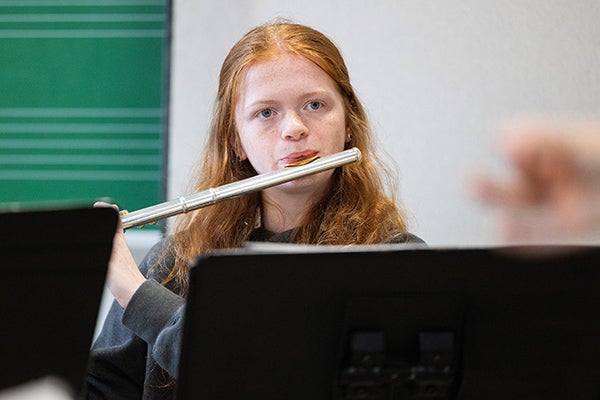 Avery Stroud of Morehead City plays flute during summer band camp in Fletcher.