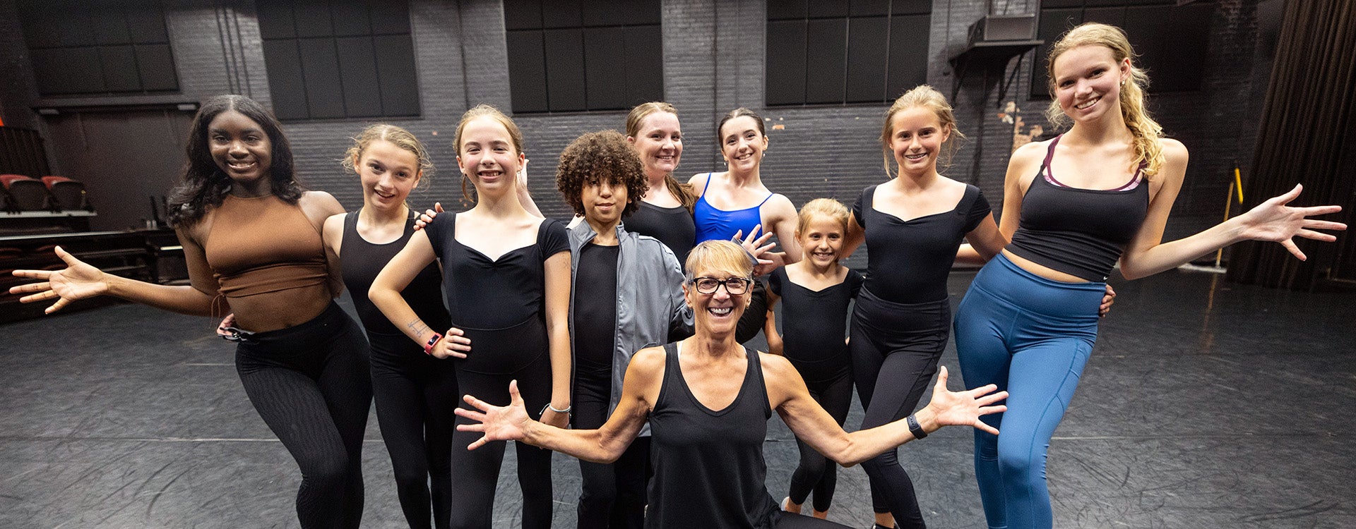 Jazz Dance Camp participants gather for a class photo with instructors Tommi Galaska, center, and ECU senior dance majors Amani Faulk, far left, and Samantha Pabst, far right.