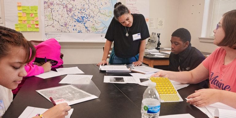 Students compile data from water samples in ECU’s Community Science Camp in Graham Building.