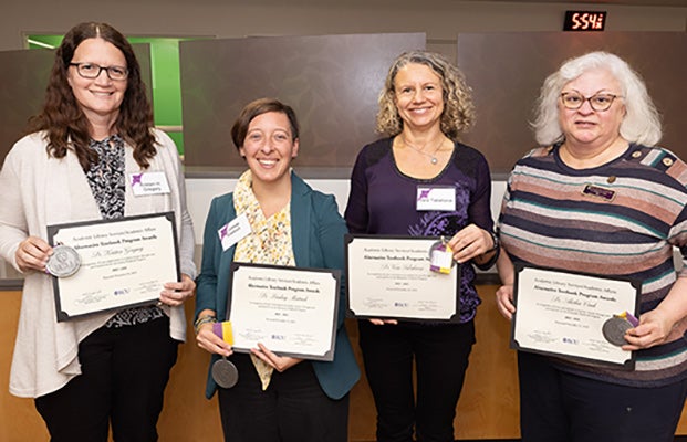 Some of the faculty participating in the 2023-24 Alternative Textbook Program pose together after receiving their award. (Photos by Rhett Butler)