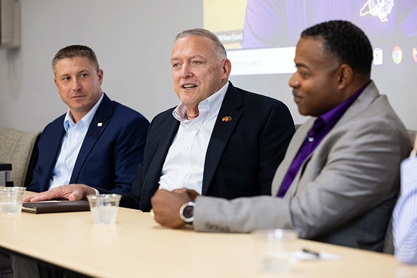 Retired Gen. Gary North talks while flanked by Lt. Col. William Dye, left, and retired Col. Derrick Floyd during a panel discussion celebrating 75 years of East Carolina University’s Air Force ROTC unit.