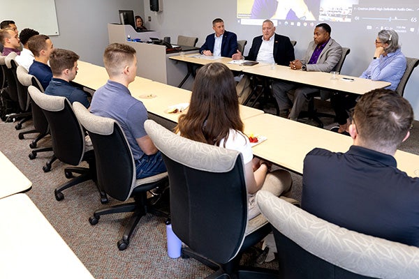 Cadets listen to retired Gen. Gary North, second from left, and others during a panel discussion celebrating 75 years of East Carolina University’s Air Force ROTC unit.