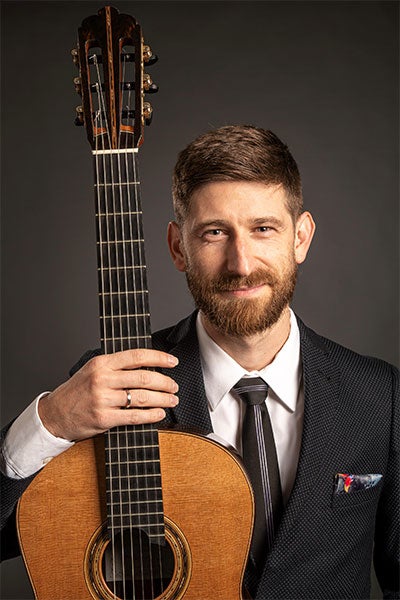 Armin Abdihodzic, ECU alumnus and professor of guitar at the University of Alaska Anchorage, will take the stage July 12.