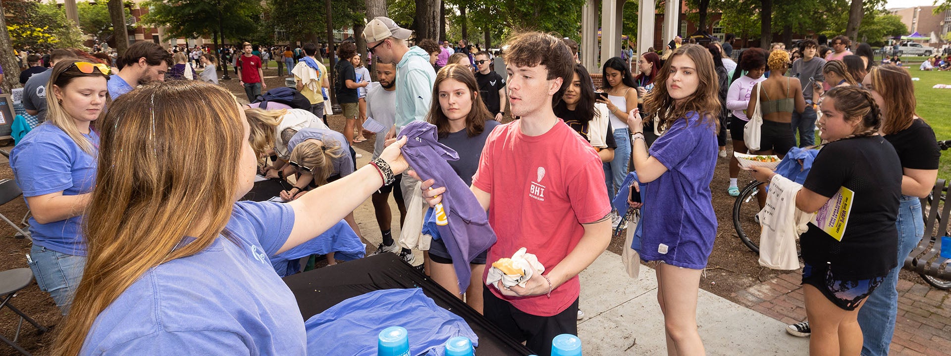 Students stand in line for a T-shirt at Barefoot on the Mall. (ECU photos by Rhett Butler)