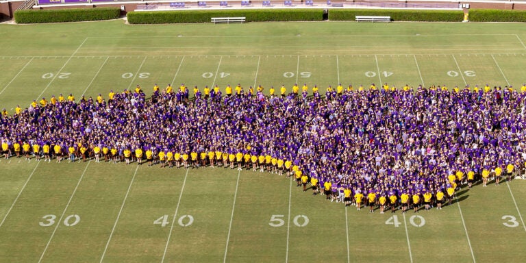 The Class of 2028 poses for a group photo at Dowdy-Ficklen Stadium. (ECU photo by Rhett Butler)