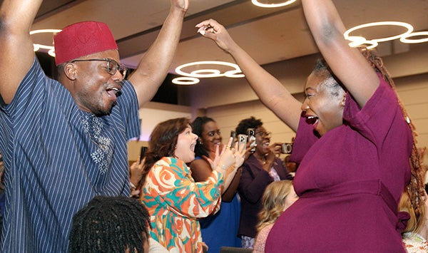 Ahoua Dembele celebrates with family during Match Day on Friday, March 15, 2024, in the Main Campus Student Center ballrooms. Dembele will stay in Greenville at ECU for her residency in obstetrics and gynecology. (Photo by Ken Buday)