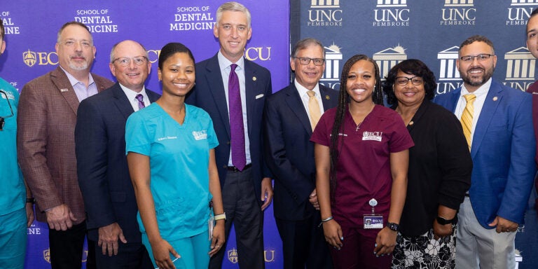 East Carolina University School of Dental Medicine students celebrate alongside state legislators and the chancellors of ECU and the University of North Carolina at Pembroke after the signing of an early assurance agreement creating a pathway to ECU’s dental school for UNCP students. (ECU photos by Rhett Butler)