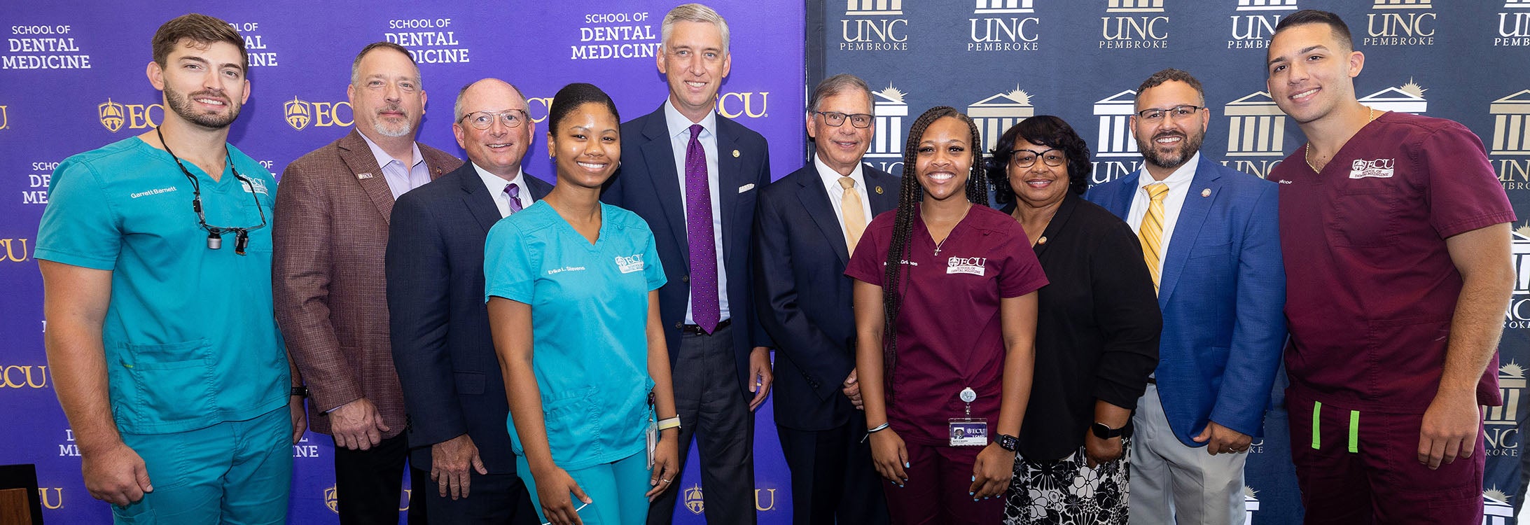 East Carolina University School of Dental Medicine students celebrate alongside state legislators and the chancellors of ECU and the University of North Carolina at Pembroke after the signing of an early assurance agreement creating a pathway to ECU’s dental school for UNCP students.