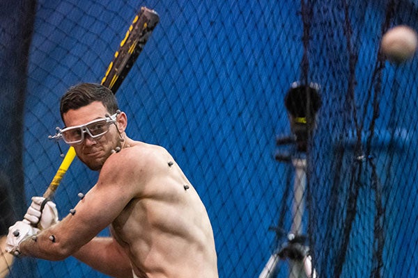 A baseball player swings at Next Level Training Center for a previous study in the College of Health and Human Performance using motion-capture and eye-tracking technology. (ECU News Services Cliff Hollis photo)