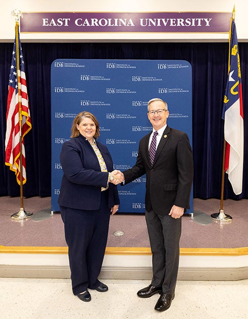 Dr. Sharon Paynter, ECU’s acting chief of research and engagement (right) and IDB president, Retired Lieutenant General Mark Faulkner, USMC (left) look to grow the partnership by developing new educational opportunities to meet the ever-changing industry, defense and professional needs.