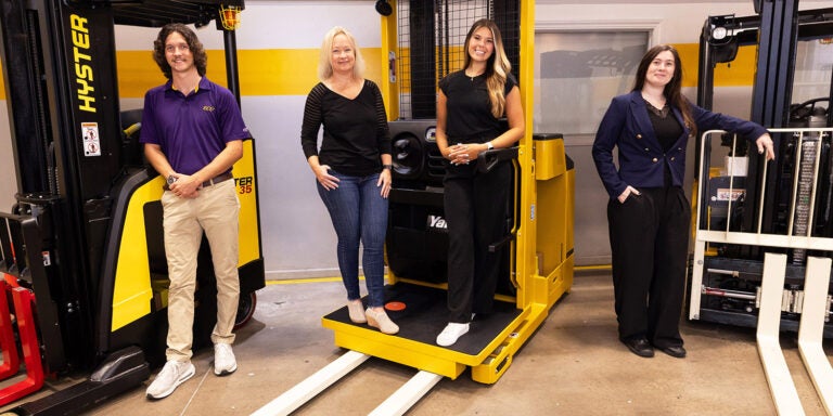 East Carolina University's new immersive master of business administration pathway will offer students like Isaiah Rutledge (left), Jenna Mallberg (center right) and Carmen Smith (right) an opportunity to earn their master's degree while interning with local businesses and leaders like Hyster-Yale Group's Ruth Anne Harrell.