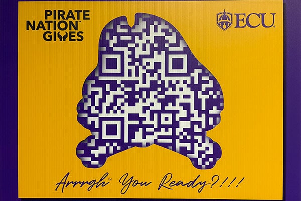 A sign displays a pirate shaped cutout.