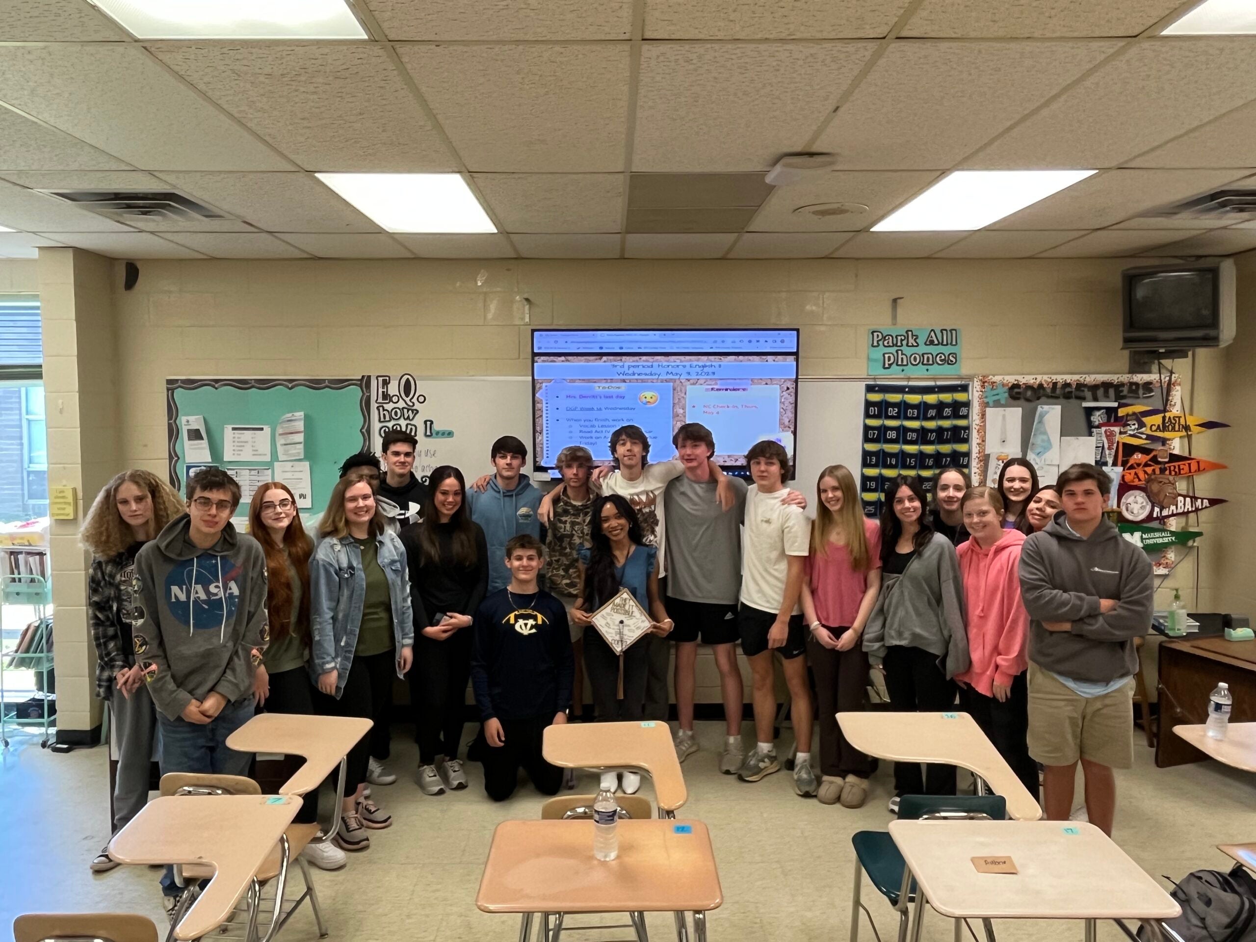 Derritt, middle, is shown with her English class at D.H. Conley High School during her ECU student teaching internship last year.