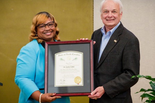 Stan Eakins accepts the Order of the Long Leaf Pine award from Rep. Gloristine Brown during the College of Business’ End-of-Year Social and Retirement Recognition Ceremony April 23. (photos courtesy of Chad Winstead)