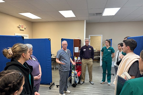Faculty member Dr. David MacPherson talks with students, residents and staff at the Hyde County Outreach Clinic in Swan Quarter. (Photo by Jon Jones)