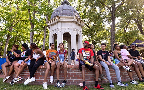 Students sit in front of the Cupola at Barefoot on the Mall. 
