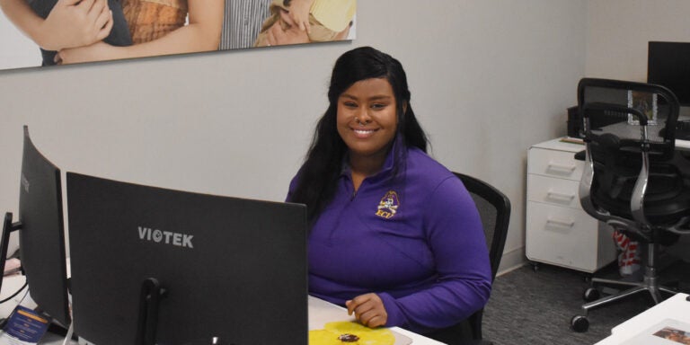 East Carolina University psychology major Jasmine Johnson uses her computer science experience to assist One Place with an important database project that benefits the community.