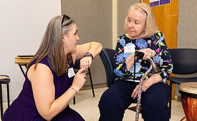 Dr. Ginny Driscoll talks with former music therapy faculty member Linda High in the new music therapy clinic in Joyner East. 