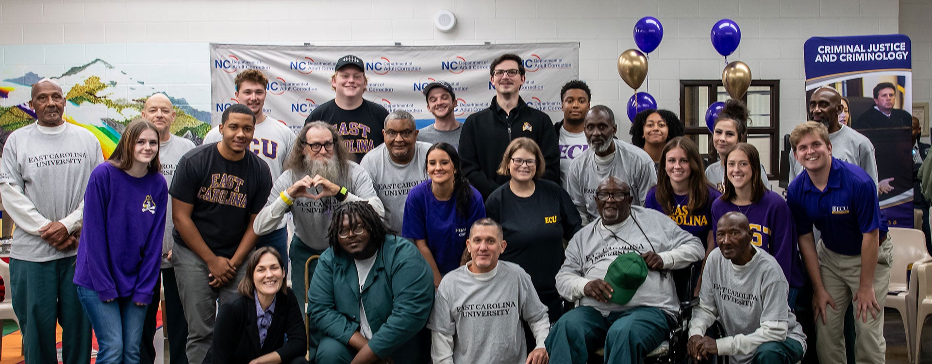  A group of students and their instructors smile and laugh on the last day of Inside-Out class at Greene Correctional Institution. 