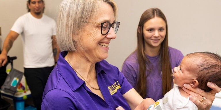 Researchers examine a baby during an appointment on campus as part of prenatal exercise research at East Carolina University. (ECU News Photo by Cliff Hollis)