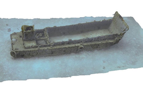  A colored, three-dimensional image of an armored troop carrier on the ocean floor.