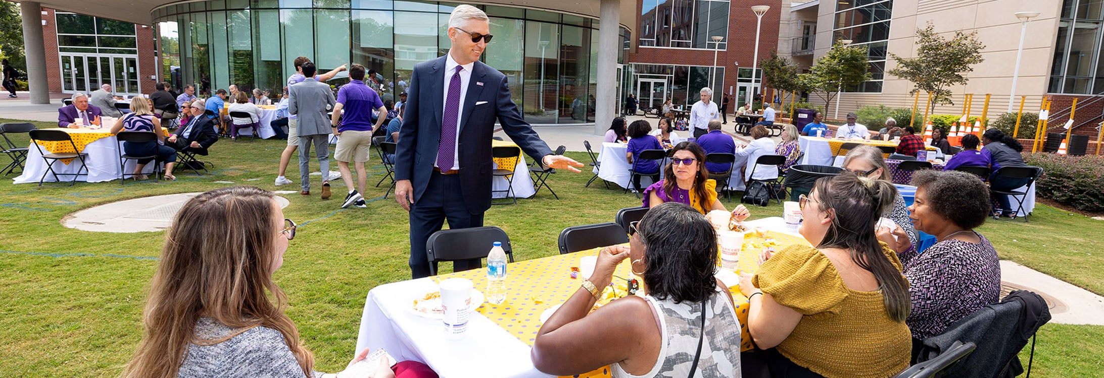 Chancellor Philip Rogers greets East Carolina University employees during lunch on the Main Campus Student Center lawn at University Day on Wednesday.