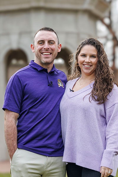 Josh and Ashley Volkan stand in front of the ECU Cupola. (Photo by Steven Mantilla)
