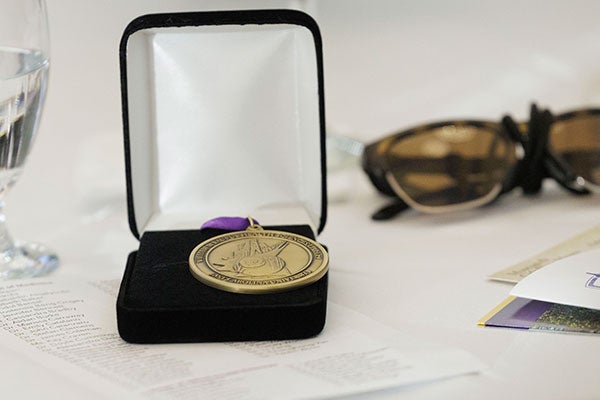  Bronze medal for authoring a health sciences book displayed on a table.