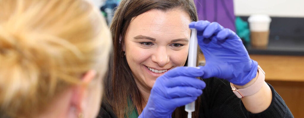 Nicole Scuron, right, STEM coordinator at Lake Forest Elementary School, conducts a chromatography experiment. (Photo by Ken Buday)