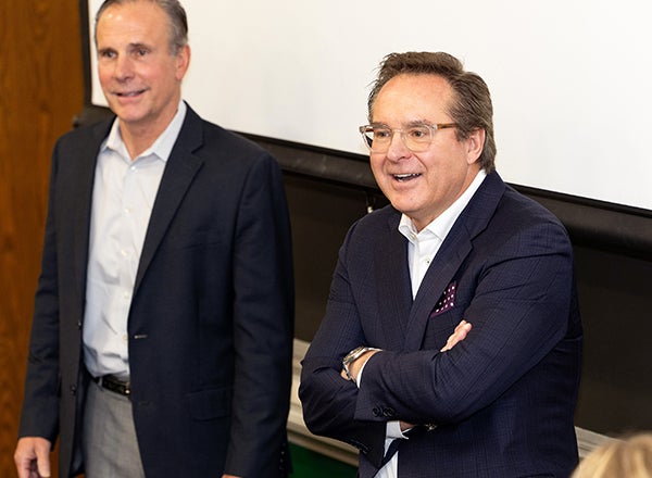 Richard Twilley, right, visits with John Chapman and his class at the College of Business. Twilley invested $4.5 million at ECU to establish the Richard G. Twilley Academy of Sales Leadership at COB. (Photo by Rhett Butler)